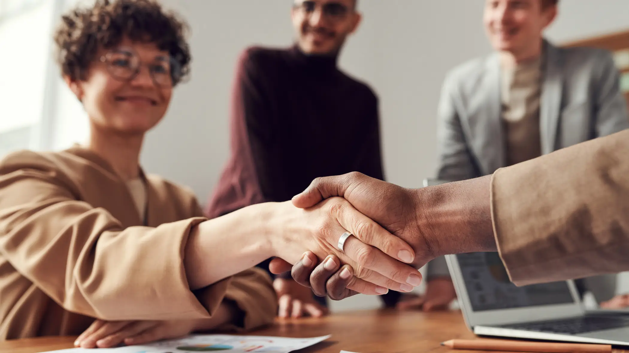 adults shaking hands